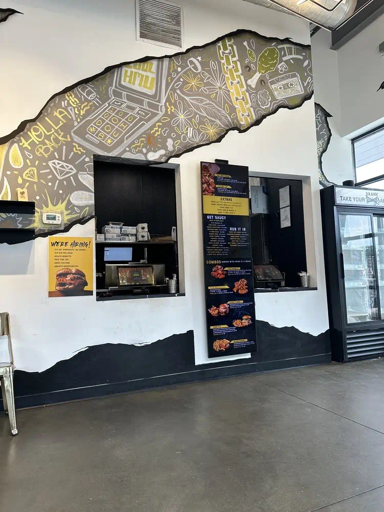 Order window with the menu boards inside Cocky Rooster Short Pump