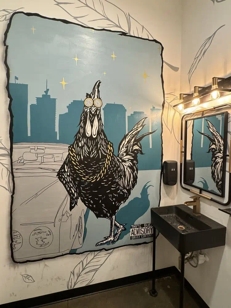 Rooster mural with the Richmond skyline painted beside the mirrors